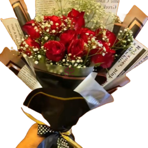 Sophisticated Mother's Day bouquet showcasing deep red roses and delicate baby's breath, presented in unique newsprint-style wrapping with a black ribbon.